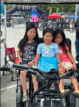 Families loving our trikes at electrify expo in Long Beach , Ca